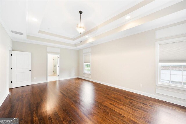 135 Broadleaf Dr, Macon, GA 31210 - spare room with visible vents, ornamental molding, wood finished floors, baseboards, and a raised ceiling