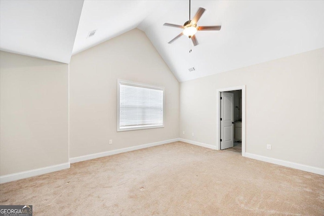 135 Broadleaf Dr, Macon, GA 31210 - unfurnished bedroom featuring visible vents, baseboards, lofted ceiling, and light carpet