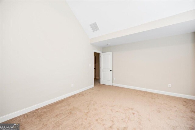 135 Broadleaf Dr, Macon, GA 31210 - empty room with baseboards, carpet, high vaulted ceiling, and visible vents