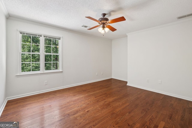 unfurnished room featuring a textured ceiling, a ceiling fan, ornamental molding, wood finished floors, and baseboards