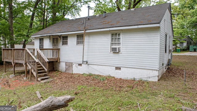 rear view of house featuring a shingled roof, stairway, a deck, crawl space, and cooling unit