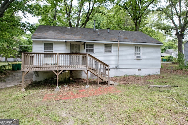 rear view of house featuring crawl space and a deck