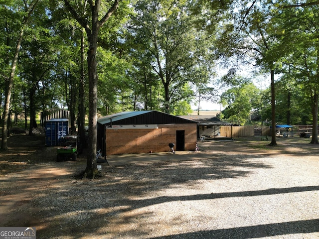 exterior space with gravel driveway
