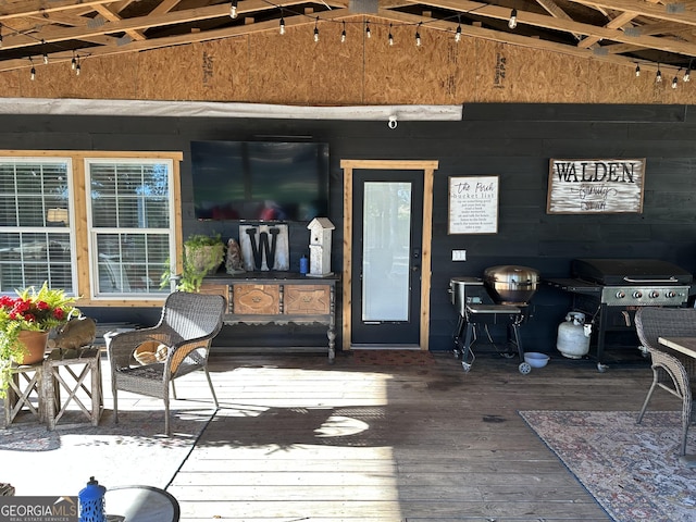 wooden terrace with area for grilling