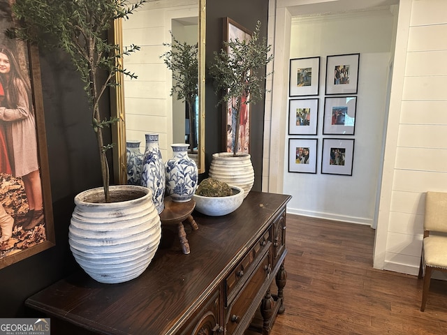 interior details featuring baseboards and wood finished floors