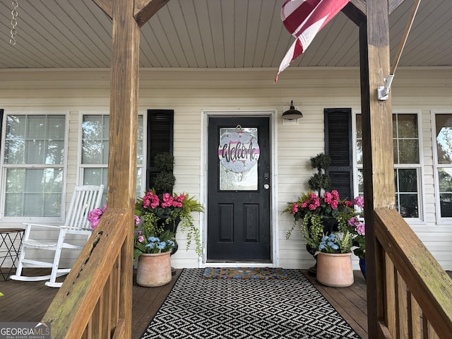 doorway to property with covered porch