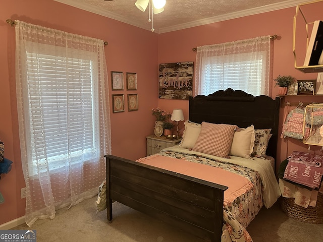 bedroom with crown molding, carpet flooring, and a textured ceiling