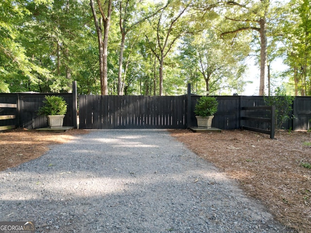 view of gate featuring fence