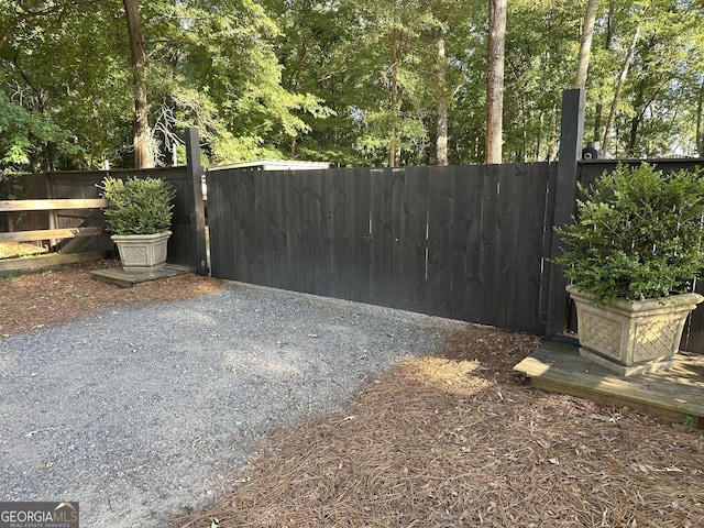 view of gate featuring fence