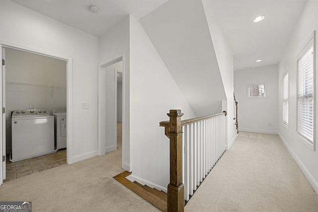 hall featuring carpet floors, recessed lighting, baseboards, and washer and dryer