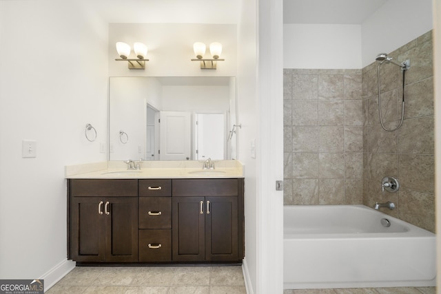 full bathroom with double vanity, baseboards, shower / tub combination, and a sink