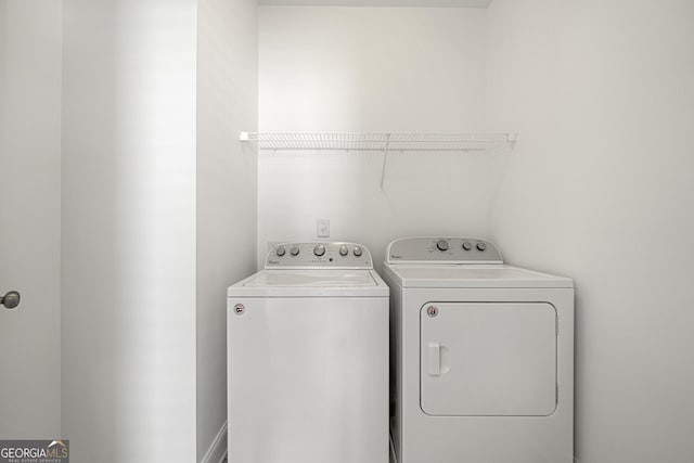 laundry room featuring laundry area and washing machine and dryer