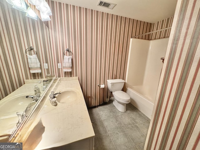 bathroom featuring vanity, toilet, tile patterned floors, wallpapered walls, and visible vents