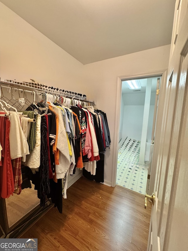 spacious closet with wood finished floors