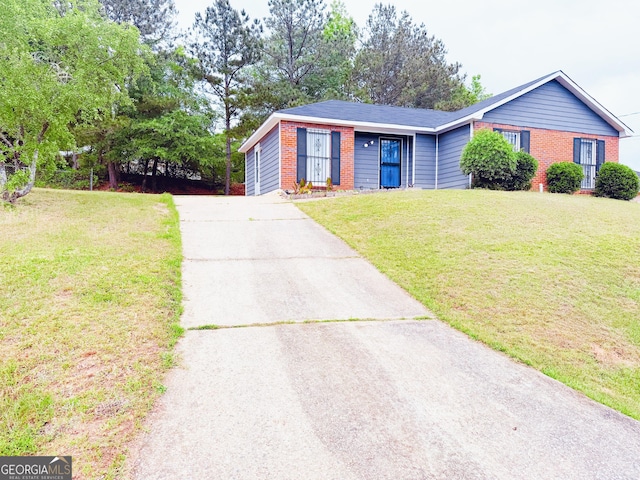 5349 Minnie Lee Dr, Columbus, GA 31907 - single story home with brick siding, driveway, and a front lawn
