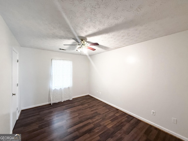 5349 Minnie Lee Dr, Columbus, GA 31907 - spare room featuring ceiling fan, dark wood-style flooring, and a textured ceiling