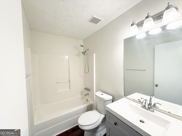 5349 Minnie Lee Dr, Columbus, GA 31907 - full bathroom with a textured ceiling, vanity, and shower / washtub combination