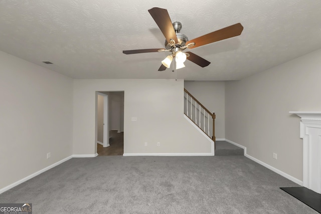 unfurnished living room featuring stairs, carpet, visible vents, ceiling fan, and baseboards