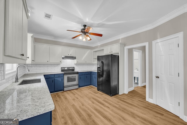 kitchen with blue cabinetry, black fridge with ice dispenser, stainless steel range with electric stovetop, a sink, and under cabinet range hood