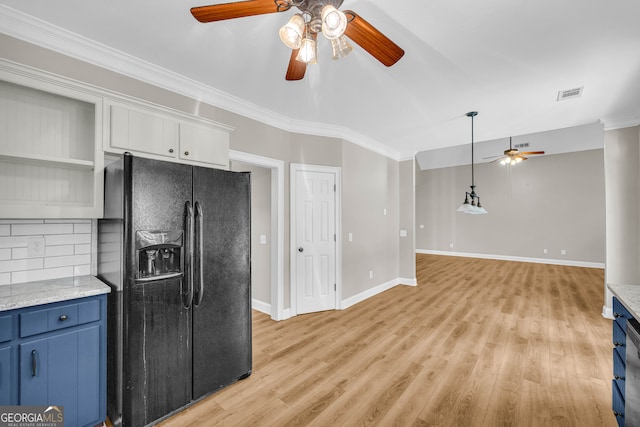 kitchen featuring visible vents, crown molding, black refrigerator with ice dispenser, ceiling fan, and blue cabinetry