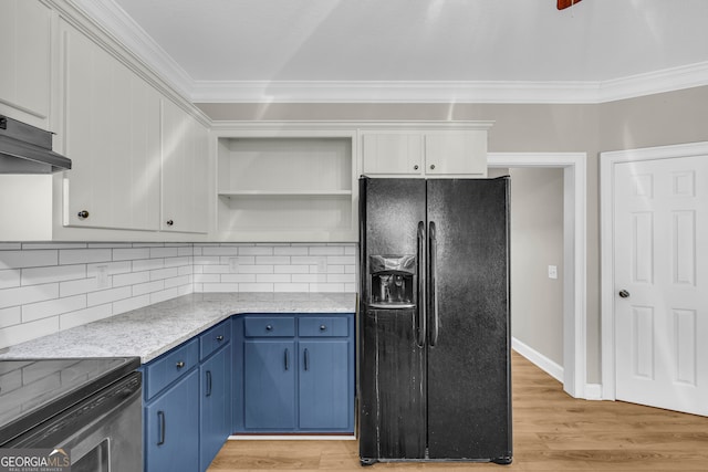 kitchen featuring open shelves, blue cabinetry, under cabinet range hood, ornamental molding, and black fridge with ice dispenser