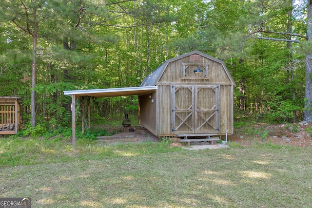 view of shed featuring a forest view and a carport
