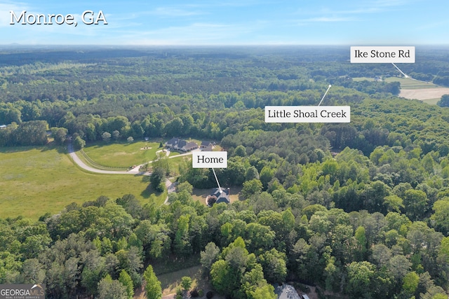 aerial view featuring a view of trees