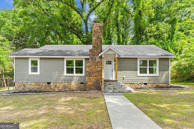 ranch-style house featuring fence, a chimney, a front lawn, and crawl space