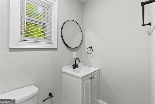 bathroom with vanity and toilet