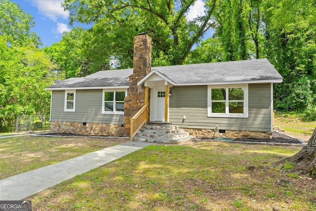 single story home featuring a chimney, a front lawn, and crawl space