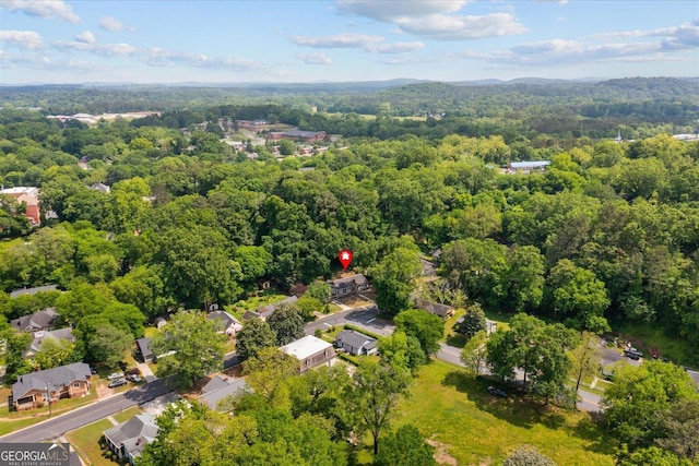 birds eye view of property with a forest view