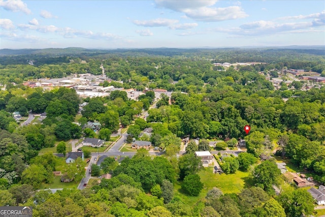 birds eye view of property with a wooded view