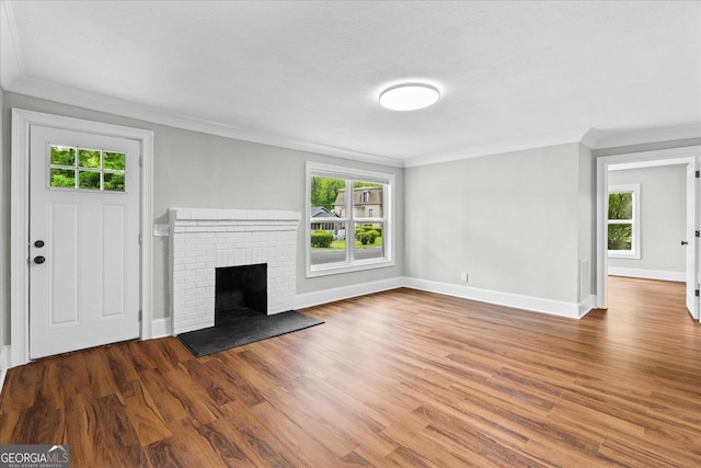 unfurnished living room with crown molding, baseboards, and a healthy amount of sunlight