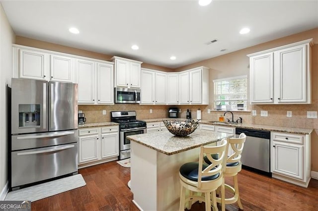 245 Tapestry Dr, Mcdonough, GA 30252 - kitchen featuring appliances with stainless steel finishes, a sink, visible vents, and tasteful backsplash
