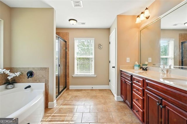 245 Tapestry Dr, Mcdonough, GA 30252 - bathroom with a healthy amount of sunlight, a stall shower, a bath, and visible vents