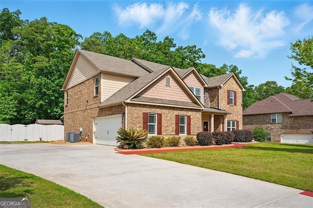 245 Tapestry Dr, Mcdonough, GA 30252 - craftsman-style home featuring driveway, a front yard, a garage, brick siding, and fence