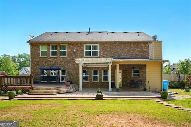 245 Tapestry Dr, Mcdonough, GA 30252 - back of property featuring fence, a pergola, a deck, brick siding, and a yard