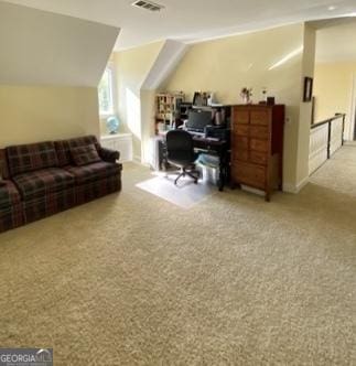 office space with vaulted ceiling, visible vents, and carpet
