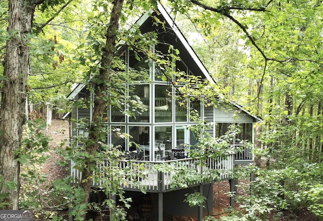 111 Milton Way, Sautee Nacoochee, GA 30571 - view of property exterior with a view of trees, a wooden deck, and a sunroom