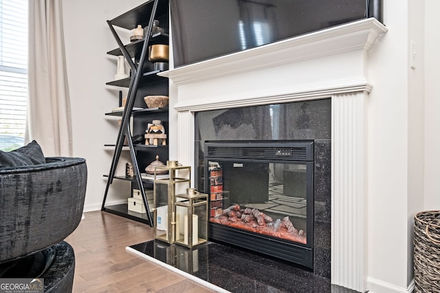 875 Venture Way SW, Atlanta, GA 30331 - room details with baseboards, a fireplace, and wood finished floors