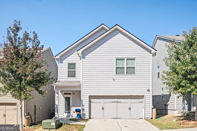 875 Venture Way SW, Atlanta, GA 30331 - traditional-style home with an attached garage and concrete driveway