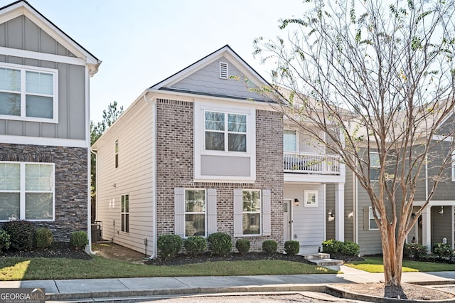 875 Venture Way SW, Atlanta, GA 30331 - view of front of house featuring brick siding, a front lawn, and board and batten siding