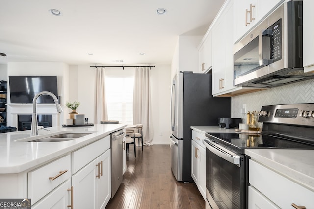 875 Venture Way SW, Atlanta, GA 30331 - kitchen featuring a sink, appliances with stainless steel finishes, backsplash, and white cabinets