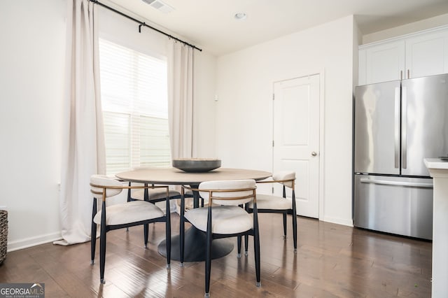 875 Venture Way SW, Atlanta, GA 30331 - dining space featuring visible vents, baseboards, and dark wood-type flooring