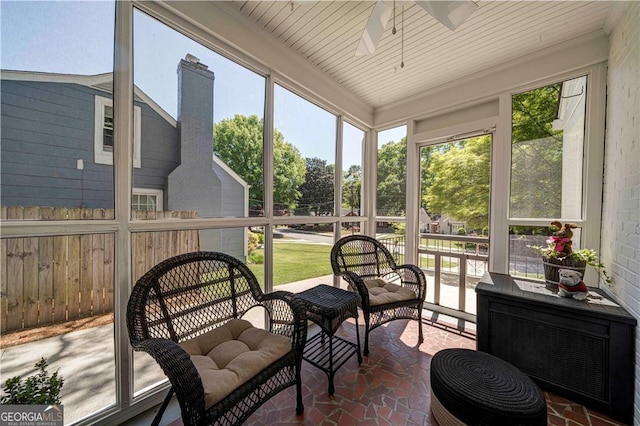 sunroom with ceiling fan and healthy amount of natural light