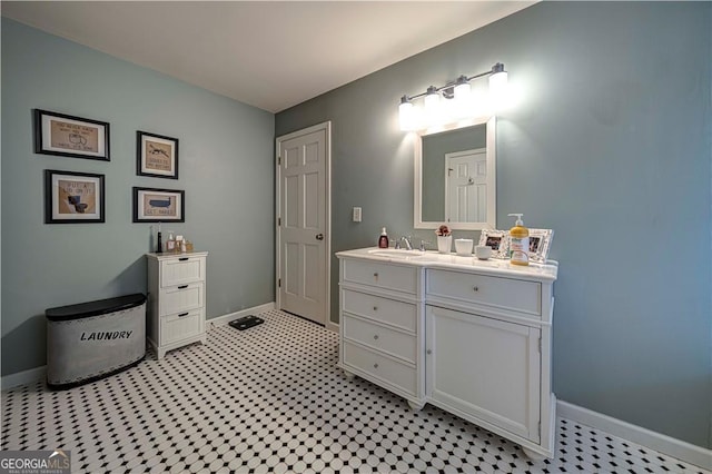 bathroom featuring baseboards and vanity