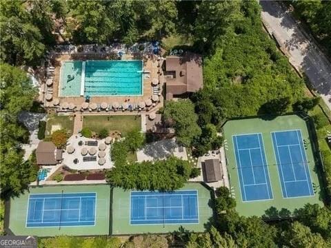 aerial view of property and surrounding area featuring a pool