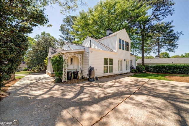 26 Kensington Rd, Avondale Estates, GA 30002 - view of front of house featuring a chimney and concrete driveway