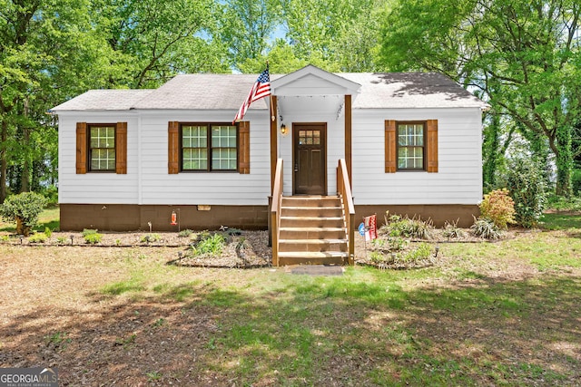 view of front of property with a shingled roof