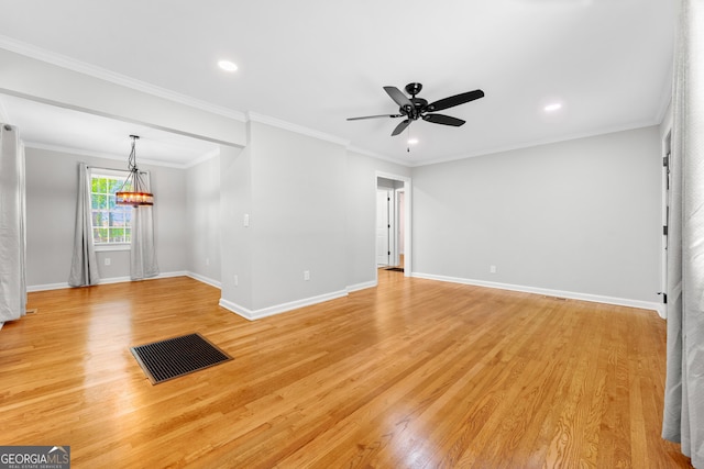unfurnished living room featuring baseboards, ceiling fan with notable chandelier, light wood finished floors, and visible vents